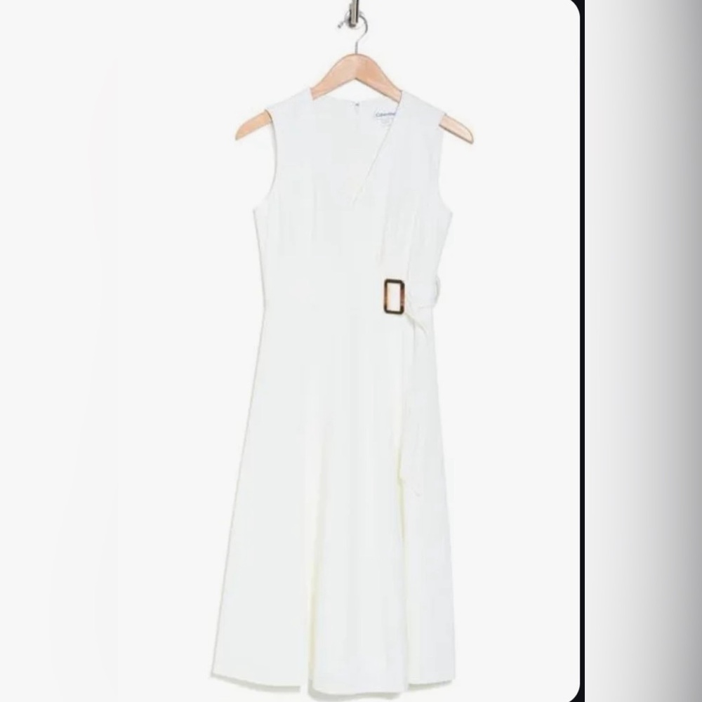 White Calvin Klein gold belted a-line dress.